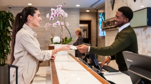 A guest being greeted at Hotel check in.