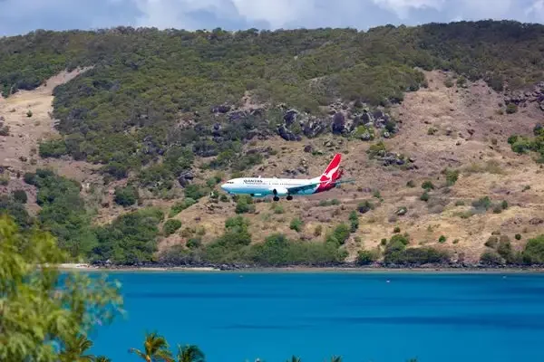 A QANTAS jet flying in to land at Hamilton Island