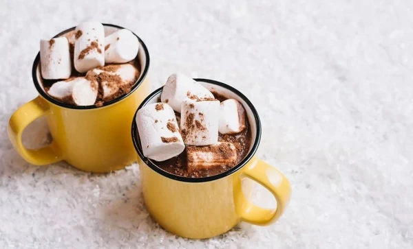 two cups of hot chocolate with marshmallows
